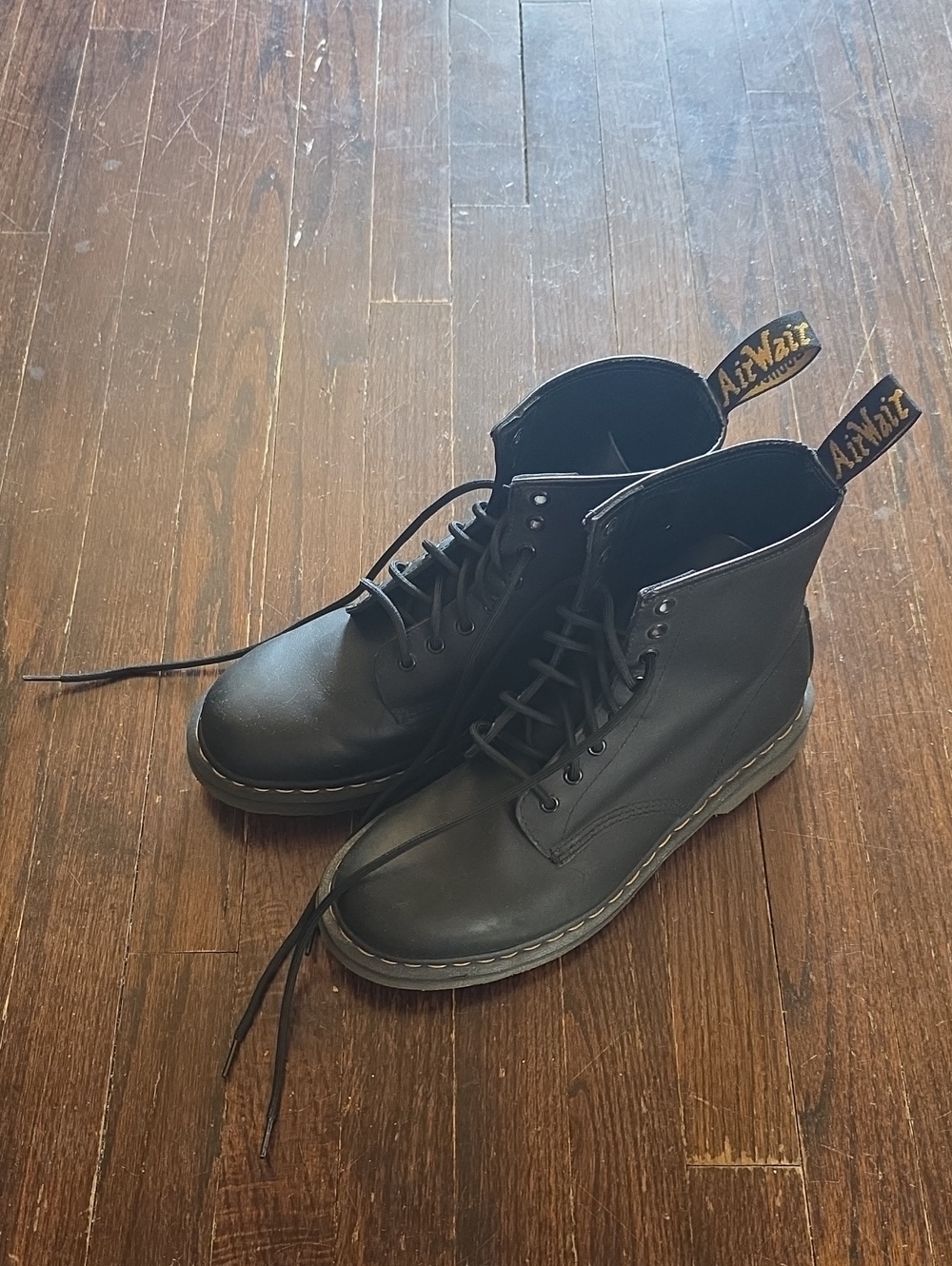 Dr. Martens Black Leather 8-Eye Lace-Up Boots with Yellow Heel Loop